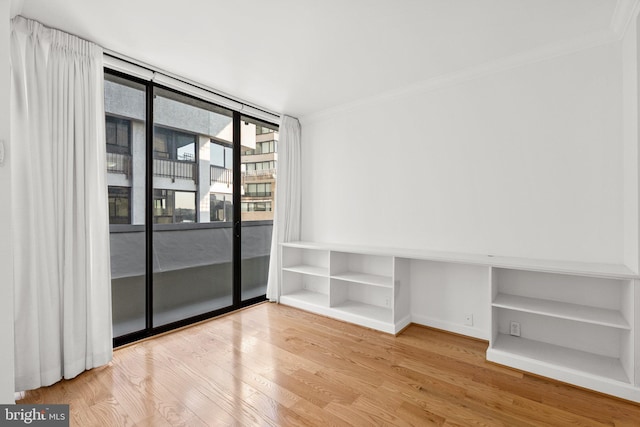 2700 Virginia Ave NW Unit 811, Washington, DC 20037 - empty room with crown molding and wood finished floors