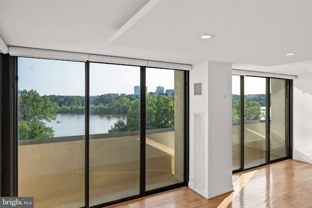 2700 Virginia Ave NW Unit 811, Washington, DC 20037 - entryway featuring wood finished floors, expansive windows, recessed lighting, and a water view