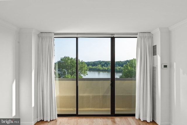2700 Virginia Ave NW Unit 811, Washington, DC 20037 - entryway with crown molding, healthy amount of natural light, light wood-type flooring, a water view, and floor to ceiling windows