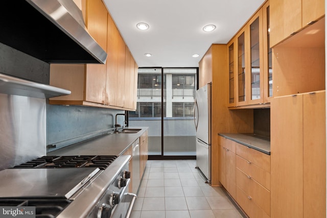 2700 Virginia Ave NW Unit 811, Washington, DC 20037 - kitchen with wall chimney range hood, freestanding refrigerator, light tile patterned floors, glass insert cabinets, and recessed lighting