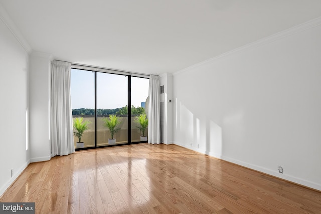 2700 Virginia Ave NW Unit 811, Washington, DC 20037 - spare room featuring a wall of windows, wood finished floors, and crown molding