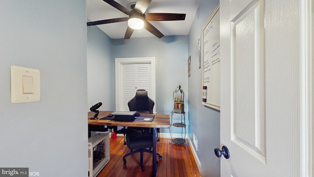 office area with baseboards, ceiling fan, wood finished floors, and visible vents