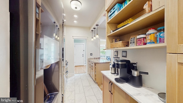interior space featuring recessed lighting and marble finish floor