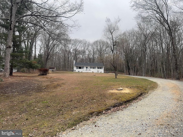 47 Estes Ln, North East, MD 21901 - exterior space with gravel driveway, a front lawn, and a view of trees