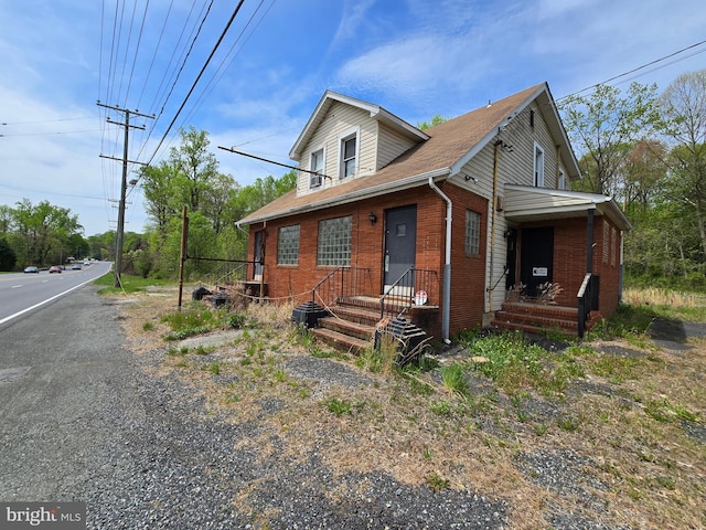 12426 Belair Rd, Kingsville, MD 21087 - view of front of house featuring roof with shingles and brick siding