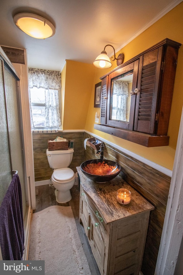606 Ridgley St, Orbisonia, PA 17243 - bathroom featuring toilet, a wainscoted wall, vanity, and a stall shower