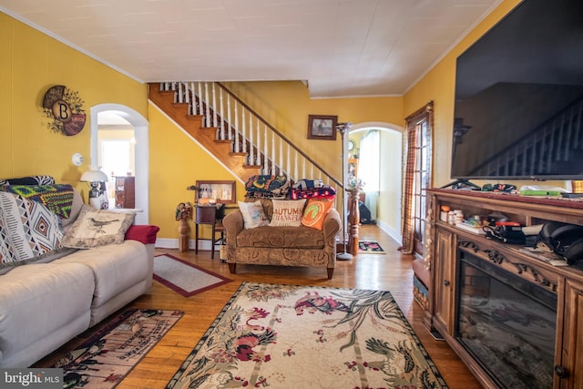 606 Ridgley St, Orbisonia, PA 17243 - living area with wood finished floors, arched walkways, crown molding, and a wealth of natural light