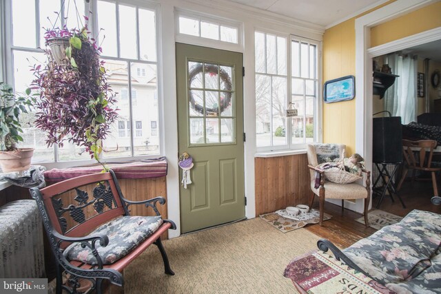 606 Ridgley St, Orbisonia, PA 17243 - entrance foyer with crown molding, wood finished floors, and wood walls