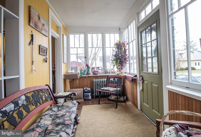 606 Ridgley St, Orbisonia, PA 17243 - sunroom with radiator heating unit, crown molding, and wood finished floors