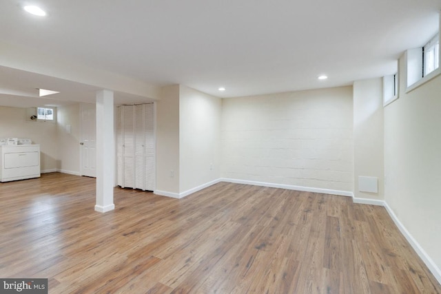 1666 Thetford Rd, Baltimore, MD 21286 - below grade area with baseboards, washer / clothes dryer, and wood finished floors