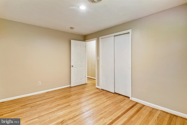 8601 Warfield Rd, Gaithersburg, MD 20882 - unfurnished bedroom with visible vents, wood finished floors, baseboards, a closet, and recessed lighting