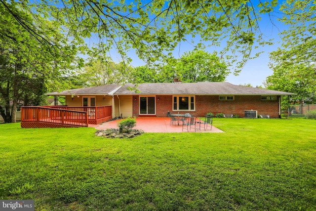 8601 Warfield Rd, Gaithersburg, MD 20882 - rear view of property with a yard, a patio area, a deck, and cooling unit