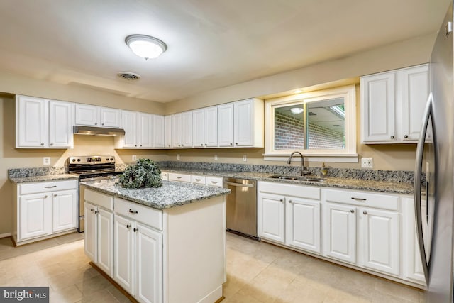 8601 Warfield Rd, Gaithersburg, MD 20882 - kitchen with visible vents, appliances with stainless steel finishes, a sink, under cabinet range hood, and white cabinetry