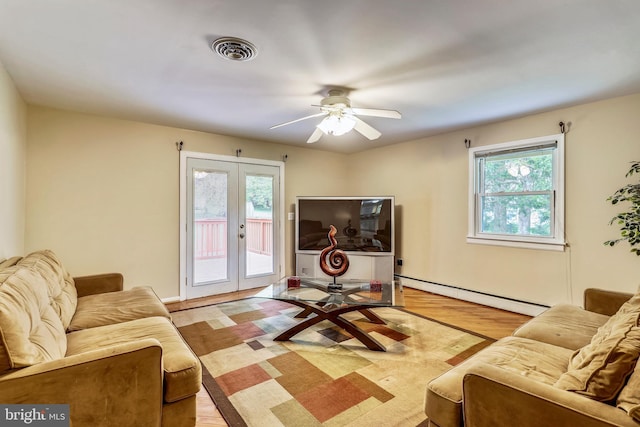 8601 Warfield Rd, Gaithersburg, MD 20882 - living area featuring ceiling fan, baseboard heating, french doors, light wood-type flooring, and visible vents