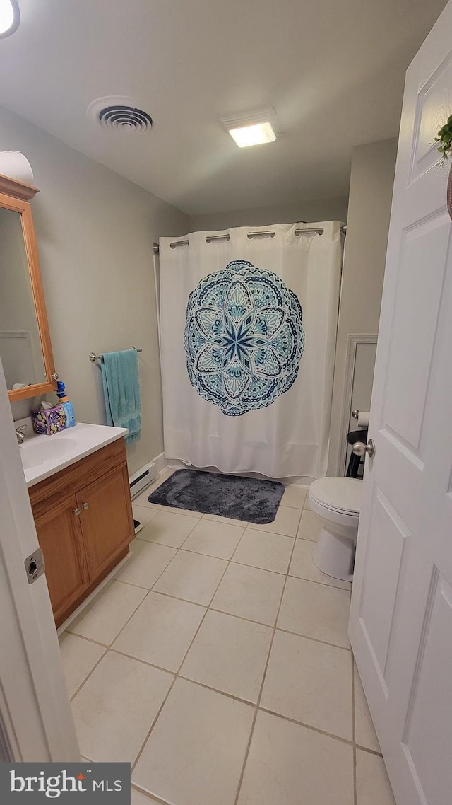 27 W Sixth St, Waynesboro, PA 17268 - bathroom with toilet, tile patterned floors, vanity, a shower with shower curtain, and baseboard heating