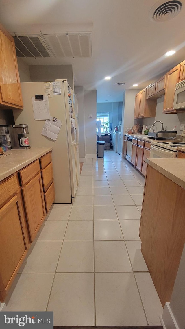 27 W Sixth St, Waynesboro, PA 17268 - kitchen featuring white appliances, light tile patterned flooring, light countertops, recessed lighting, and light brown cabinetry