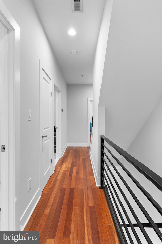 2714 W Jefferson St, Philadelphia, PA 19121 - hallway with wood finished floors, an upstairs landing, visible vents, and baseboards