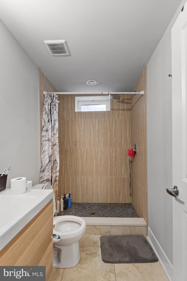 2714 W Jefferson St, Philadelphia, PA 19121 - bathroom with visible vents, toilet, a tile shower, tile patterned flooring, and vanity