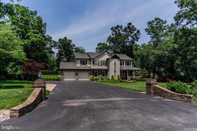 61 Sedgwick Dr, East Berlin, PA 17316 - view of front of house with driveway, a front yard, and an attached garage