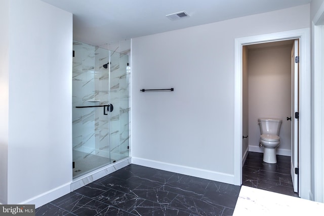bathroom featuring a marble finish shower, baseboards, visible vents, and marble finish floor