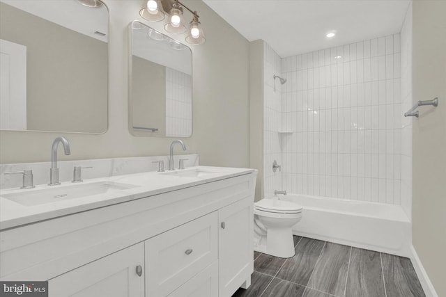 full bath featuring shower / tub combination, toilet, double vanity, and a sink