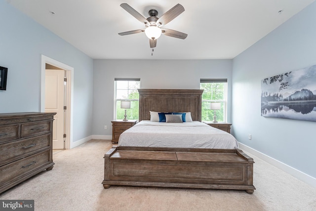 427 Whispering Elm Ln, Millersville, MD 21108 - bedroom with light colored carpet, multiple windows, baseboards, and a ceiling fan