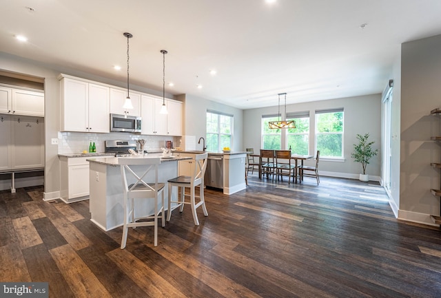 427 Whispering Elm Ln, Millersville, MD 21108 - kitchen with stainless steel appliances, a center island, tasteful backsplash, healthy amount of natural light, and recessed lighting