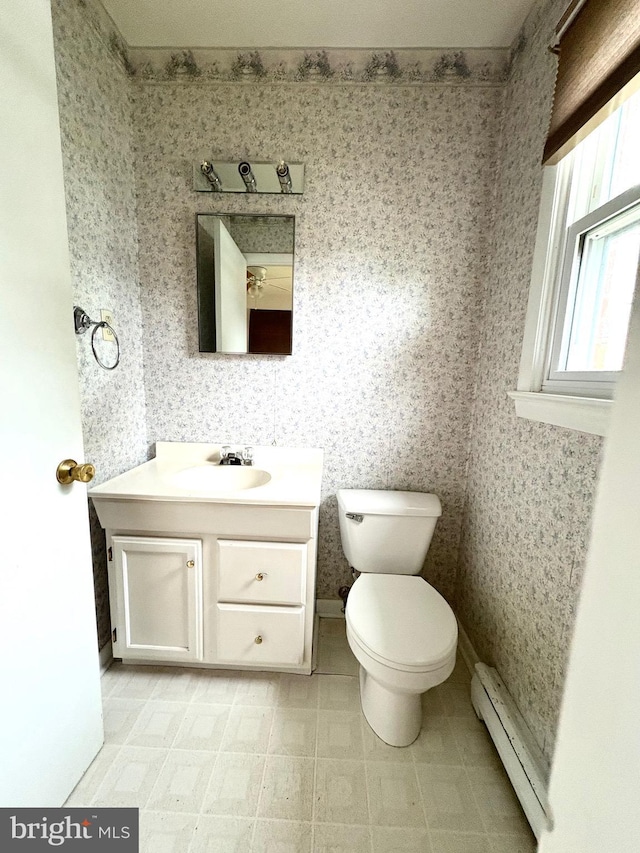 205 Parkway St, Winchester, VA 22601 - bathroom with a baseboard radiator, vanity, toilet, wallpapered walls, and baseboards