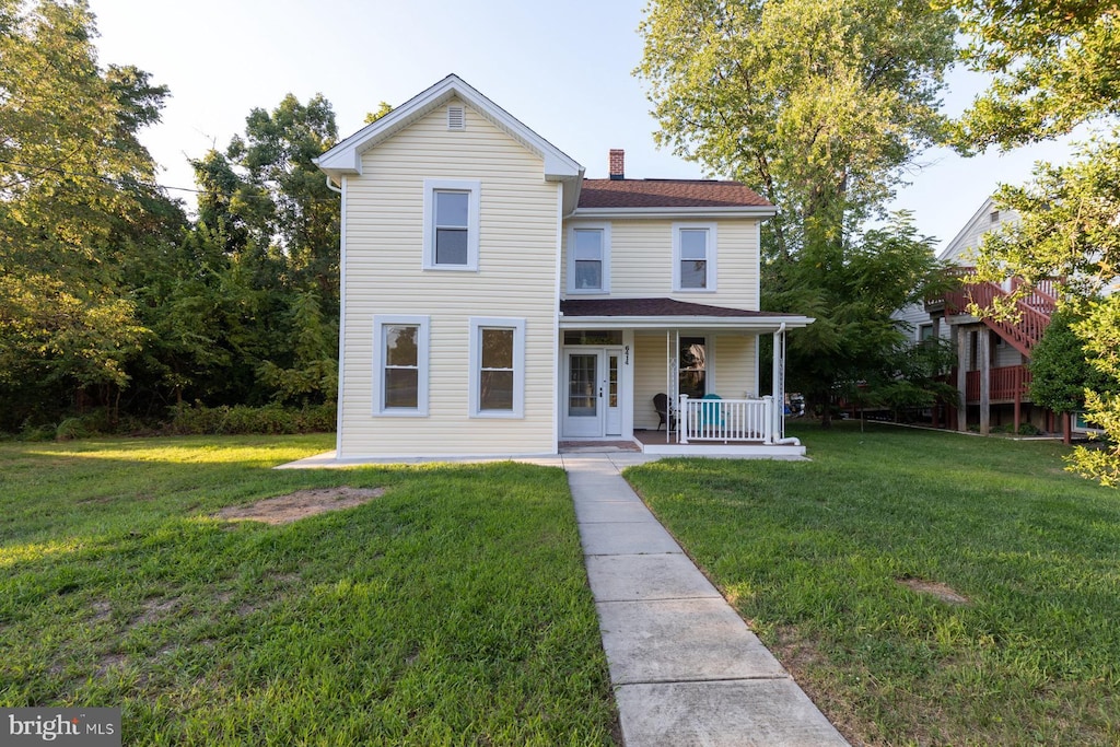 6414 Old Landover Rd, Landover, MD 20785 - view of front of home with a chimney, roof with shingles, a porch, and a front yard