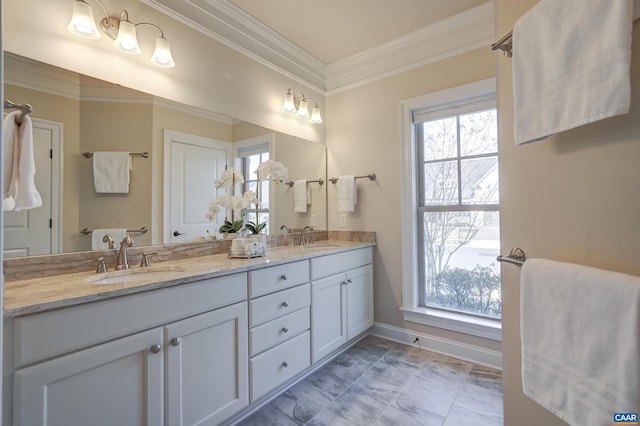 bathroom featuring a sink, ornamental molding, and double vanity