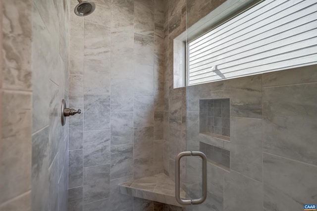 full bath featuring a shower stall