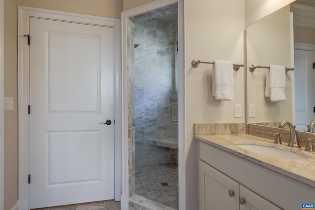full bathroom featuring a stall shower and vanity