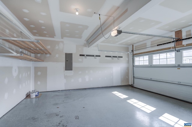 garage featuring electric panel and a garage door opener