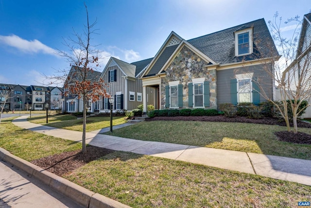 view of front facade with stone siding, a residential view, and a front lawn