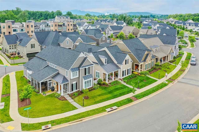 birds eye view of property with a residential view