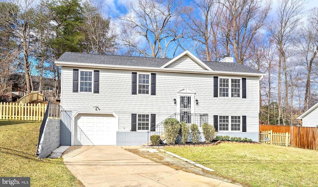 8801 Temple Hill Rd, Clinton, MD 20735 - split foyer home featuring driveway, fence, a front yard, a garage, and a chimney