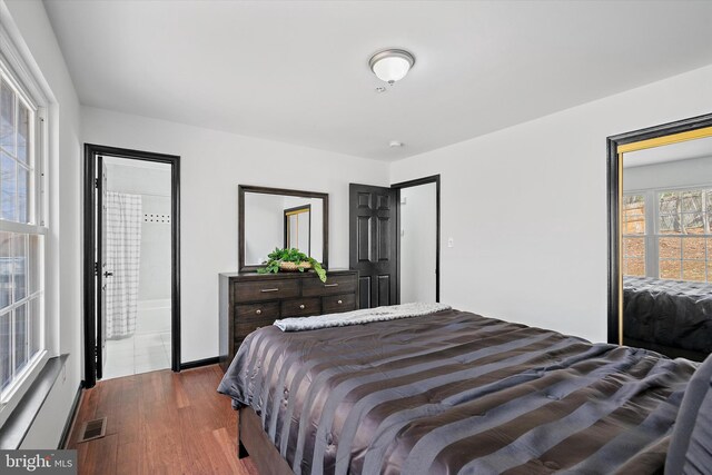 8801 Temple Hill Rd, Clinton, MD 20735 - bedroom with dark wood-style floors and visible vents