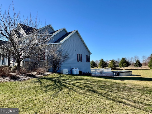 view of home's exterior featuring a yard