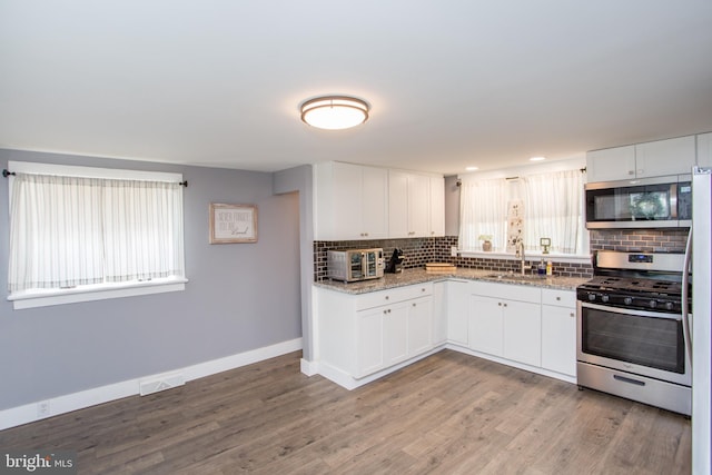 445 Blue Bell Rd, Williamstown, NJ 08094 - kitchen featuring tasteful backsplash, visible vents, a sink, and appliances with stainless steel finishes