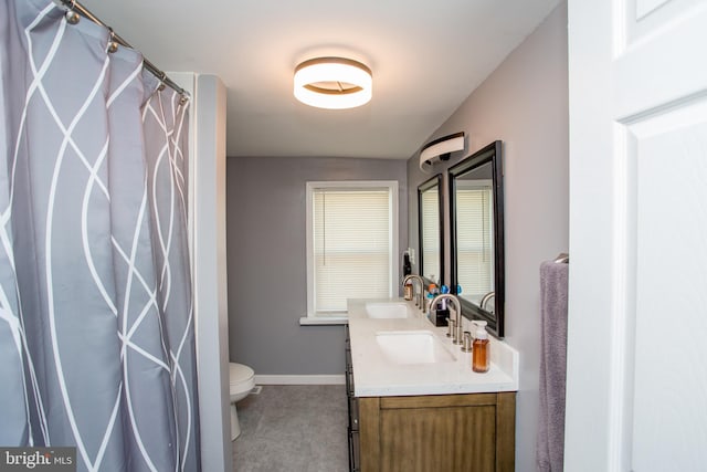 445 Blue Bell Rd, Williamstown, NJ 08094 - full bathroom with toilet, double vanity, a sink, and baseboards
