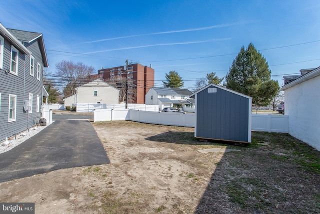 445 Blue Bell Rd, Williamstown, NJ 08094 - view of yard featuring an outbuilding, a storage unit, and a fenced backyard