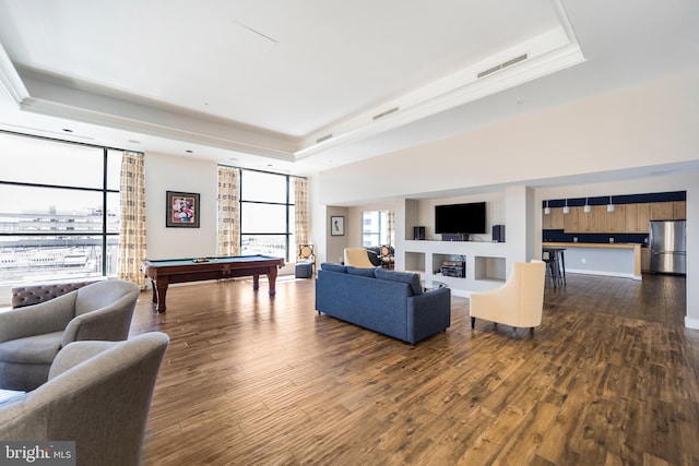 living room with dark wood finished floors, pool table, visible vents, and a raised ceiling