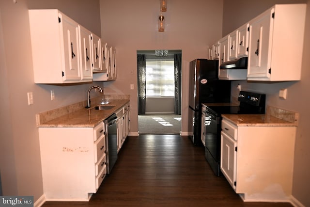3539 Smokethorn Ct, Waldorf, MD 20602 - kitchen with black range with electric stovetop, under cabinet range hood, a sink, stainless steel dishwasher, and white cabinetry