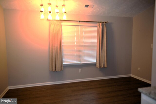 3539 Smokethorn Ct, Waldorf, MD 20602 - empty room with visible vents, wood finished floors, baseboards, and a textured ceiling