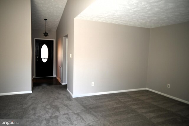 3539 Smokethorn Ct, Waldorf, MD 20602 - foyer entrance with baseboards, dark colored carpet, and a textured ceiling