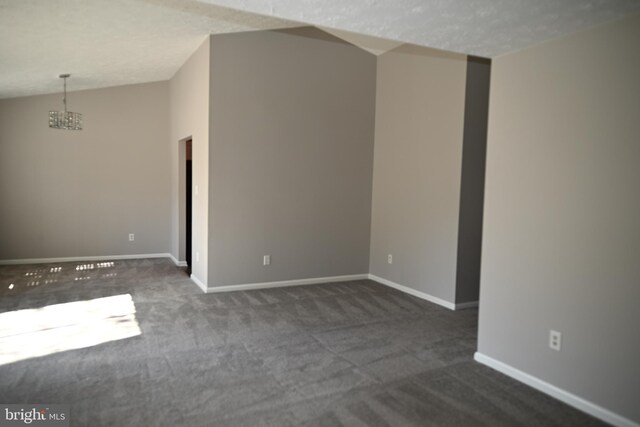 3539 Smokethorn Ct, Waldorf, MD 20602 - empty room featuring a chandelier, lofted ceiling, baseboards, and dark colored carpet