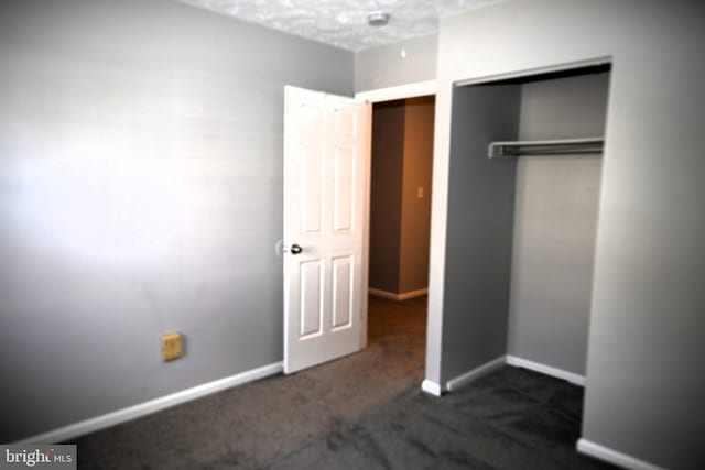 3539 Smokethorn Ct, Waldorf, MD 20602 - unfurnished bedroom featuring a closet, baseboards, and dark colored carpet
