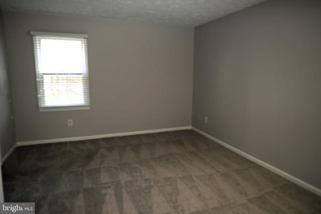 3539 Smokethorn Ct, Waldorf, MD 20602 - carpeted empty room featuring a textured ceiling and baseboards