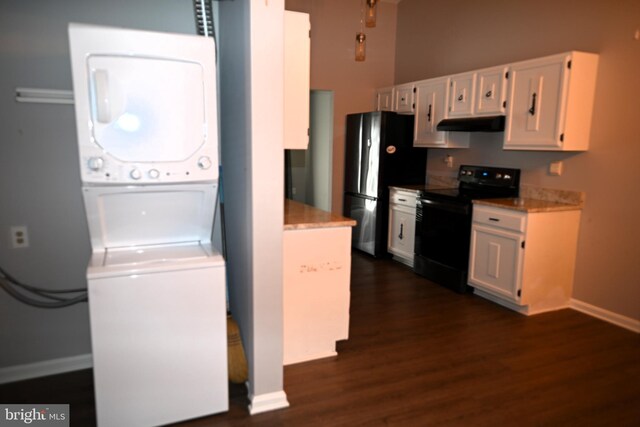 3539 Smokethorn Ct, Waldorf, MD 20602 - kitchen featuring black range with electric stovetop, under cabinet range hood, freestanding refrigerator, white cabinets, and stacked washer / drying machine