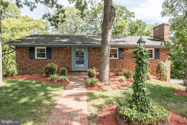 126 Armstrong Pl, Winchester, VA 22602 - ranch-style house with a front yard, brick siding, and a chimney